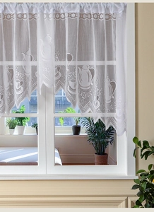 Detailed lace texture of white cafe curtain featuring elegant kitchen themed embroidery
