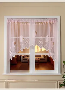 Close-up of pink French lace cafe curtain with floral and coffee pot embroidery patterns