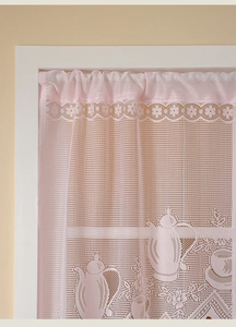 Detail of pink French lace cafe curtain featuring intricate teapot and floral patterns