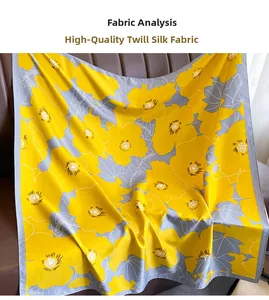 Detailed view of high-quality twill silk scarf featuring yellow floral patterns on leather