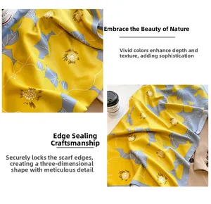 Detail of yellow silk scarf with grey floral print paired with a khaki blazer and coffee