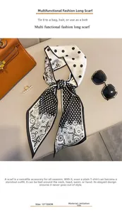 Close-up of 15x150cm polka dot twilly scarf in faux silk tied on a leather handbag