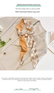 Close-up of geometry pattern silk scarf tied on a beige blazer for styling detail