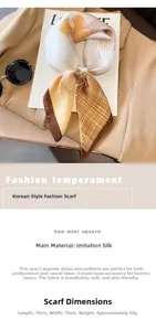 Detailed view of a 70x70cm floral silk-like scarf folded on a blazer with geometric patterns