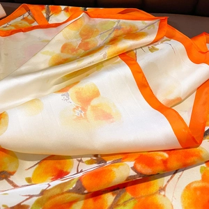 Orange and beige faux silk square scarf with persimmon prints and rolled edges