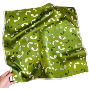 Elegant green silk square scarf with abstract floral print and delicate white border