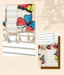 Detailed lace cafe curtain featuring colorful embroidered butterflies and cotton tassels