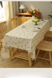 Detail of floral embroidery and tassels on a premium linen-cotton rectangle tablecloth