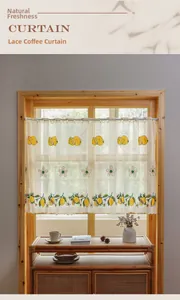 Macro detail of lace cafe curtain with lemon embroidery and wavy scalloped edge design