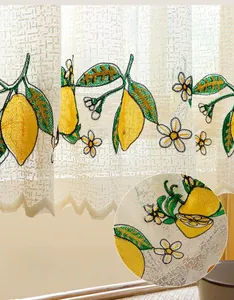 Macro detail of high-quality lemon embroidery and scalloped edges on white lace cafe curtain