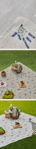 Close-up of floral embroidery and woven texture on a waterproof picnic mat