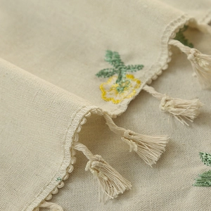 Rectangle tablecloth with floral embroidery and tassels on natural cotton linen fabric