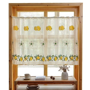 Sheer white cafe curtain with embroidered yellow lemon patterns and wavy lace edge