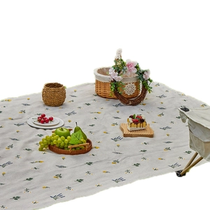 Portable floral picnic mat for outdoor camping and beach, featuring a minimalist plant pattern