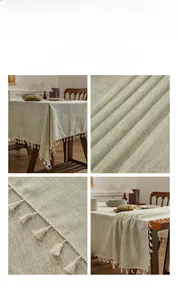 Detail of light green linen tablecloth with elegant off-white woven fringe edges