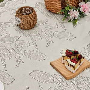Modern white tulip jacquard picnic mat with delicate lace edges for outdoor camping and garden