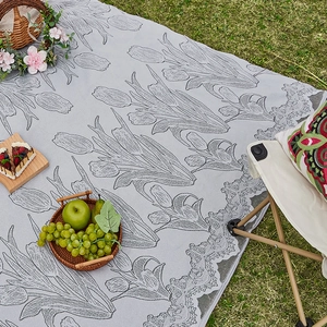 Modern light grey picnic mat with tulip jacquard pattern and delicate lace trim for camping