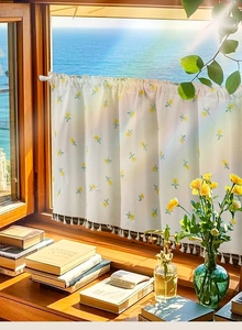 Detail of white cafe curtain with yellow flower embroidery and delicate tassel trim