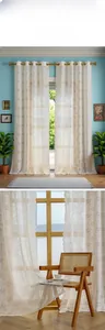 Close-up of white floral lace embroidery on semi-sheer curtains for a cozy home atmosphere
