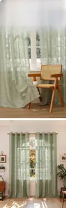 Detail of light green floral lace curtain with hollow crochet pattern and hanging holes