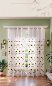 Detailed close-up of embroidered sunflower pattern on white semi-sheer tulle curtains