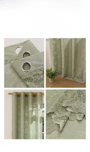 Detailed close-up of light green floral lace curtain with metal grommets and scalloped edges