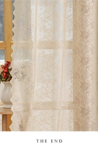 Detail of floral lace sheer curtain in beige with elegant wavy scalloped edges