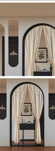 Close-up of Bohemian cream lace door curtain with intricate embroidery and elegant tassels