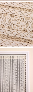 Macro detail of bohemian lace door curtain with floral embroidery and tassel fringe
