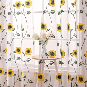 White semi-sheer curtain with yellow sunflower embroidery in a sunlit country style room