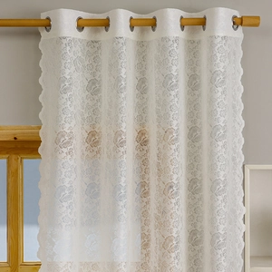 White floral lace sheer curtain with silver grommets and elegant scalloped edges