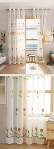 Detail of tulip embroidery on white sheer curtain with metal grommets in a bright living room