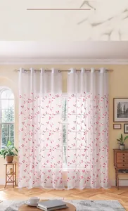 Detail of white sheer curtain with red vine embroidery and metal grommet top headers