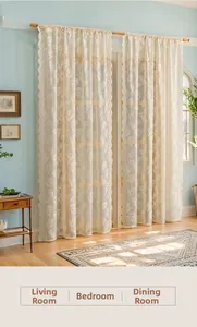 Detailed view of cream tulip embroidery and wavy lace edges on semi-sheer tulle curtains