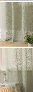 Close-up of light green floral lace curtain with delicate wavy edges for soft room lighting