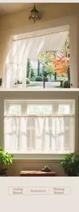 Close-up of beige striped linen cafe curtain with decorative tassels for home decor