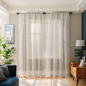 White floral lace curtains in sheer polyester mesh with scalloped edges for living room
