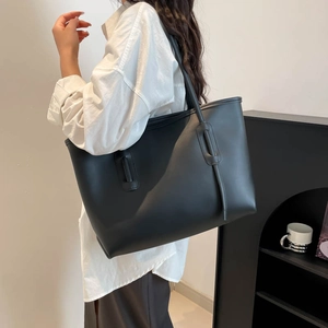 Minimalist large black leather tote bag for women, stylish shoulder bag for daily commuting