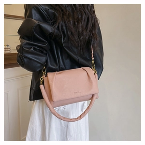 Pink lychee texture leather shoulder bag with gold chain and Giorgio A logo on model