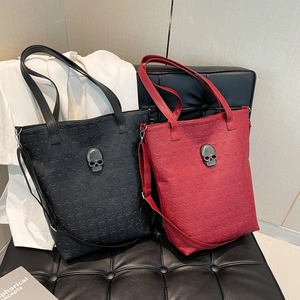 Fashion skull embossed tote bags in black and burgundy with metallic skull accents
