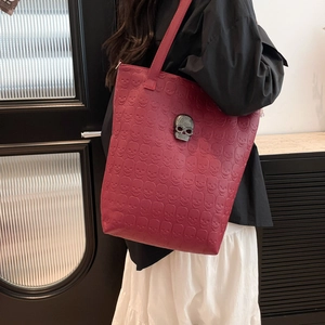 Dark red oversized skull embossed leather tote bag with gothic metal skull detail