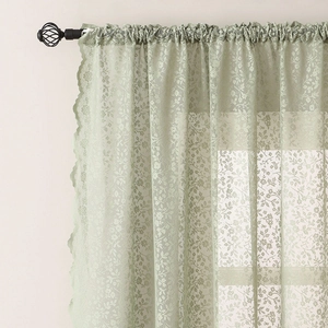 Pastel green floral lace curtain with wavy edges for a minimalist summer balcony look