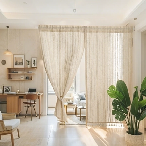 Beige cotton room divider curtain with vertical texture and stylish tassel edges