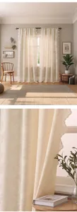 Detail of French tulip embroidery on cream sheer curtains with delicate scalloped lace edges