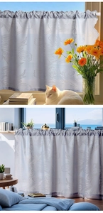 Detailed view of light gray lace cafe curtain with elegant tulip floral patterns and wavy edges