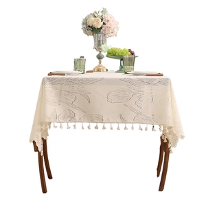 Modern tulip embroidery tablecloth with elegant tassel edges in cream linen finish