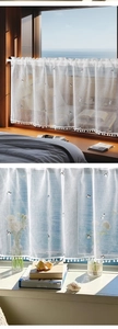 Detail of white semi-sheer cafe curtain with black cat embroidery and pom-pom trim