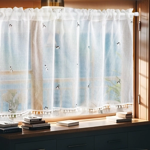White semi-sheer cafe curtain with cute cat embroidery and pom-pom trim for windows
