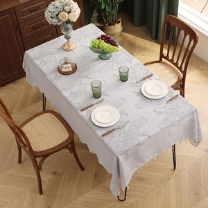 Modern grey rectangle tablecloth with tulip embroidery and white tassel fringe detail