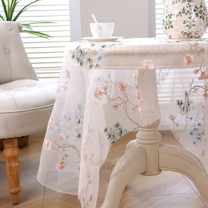Elegant white mesh tablecloth with delicate pink cherry blossom embroidery for round tables